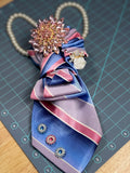 Ruthie's "My Fair Lady" Powder Blue & Pink Striped Necktie Necklace | Blush Pink Sunburst Brooch & White Rose Statement Piece